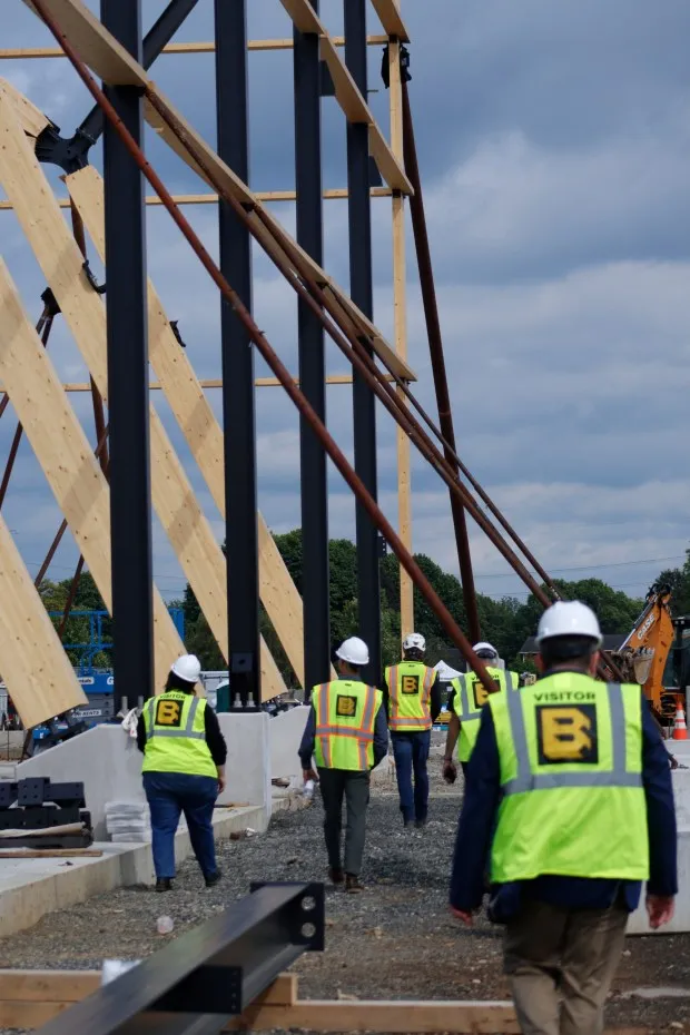 Guests take a tour of the construction site Thursday, May 29, 2025, at the Upper Macungie Township Community Lifestyle Center. (Oliver Lois Economidis/The Morning Call)