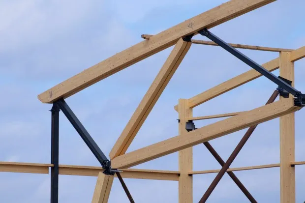 Numerous wooden pieces, including heavy wooden trusses, are seen Thursday, May 29, 2025, at the Upper Macungie Township Community Lifestyle Center. The pieces will ensure the building's longevity. (Oliver Lois Economidis/The Morning Call)