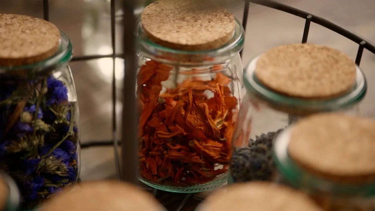 Jars filled with dry leaves.