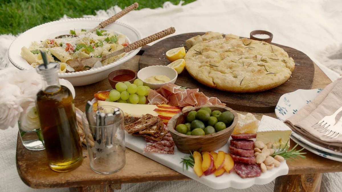 Focaccia placed next to a charcuterie board on a table.