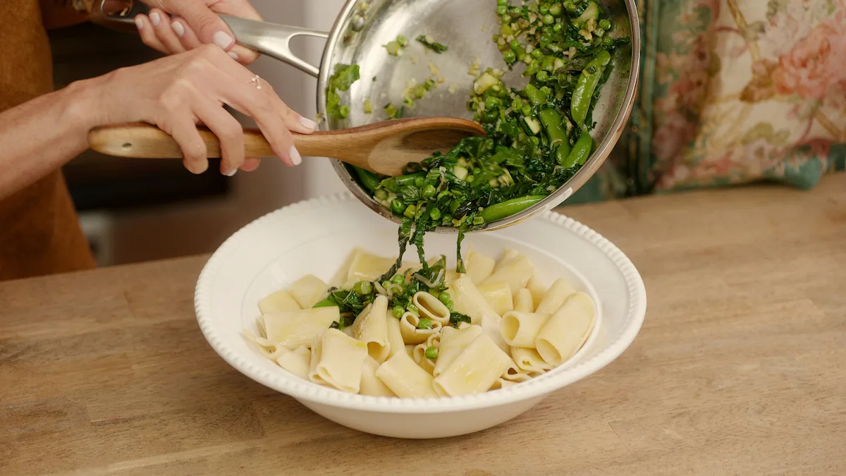 Pasta salad being plated.