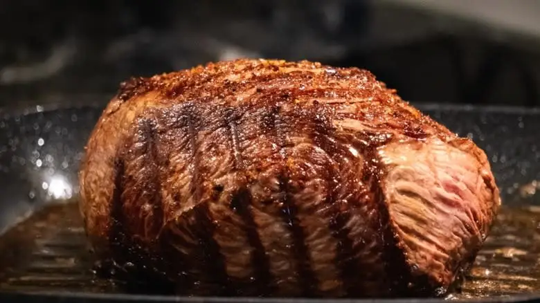 Roast beef cooks in an oven