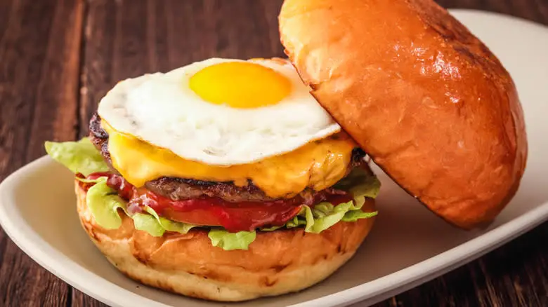 fried egg atop cooked burger