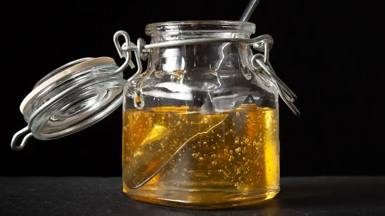 agave syrup in jar with spoon