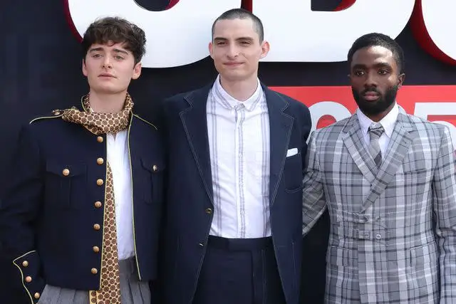 Kevin Winter/Getty  Noah Schnapp, Finn Wolfhard, and Caleb McLaughlin attend Netflix's Tudum 2025