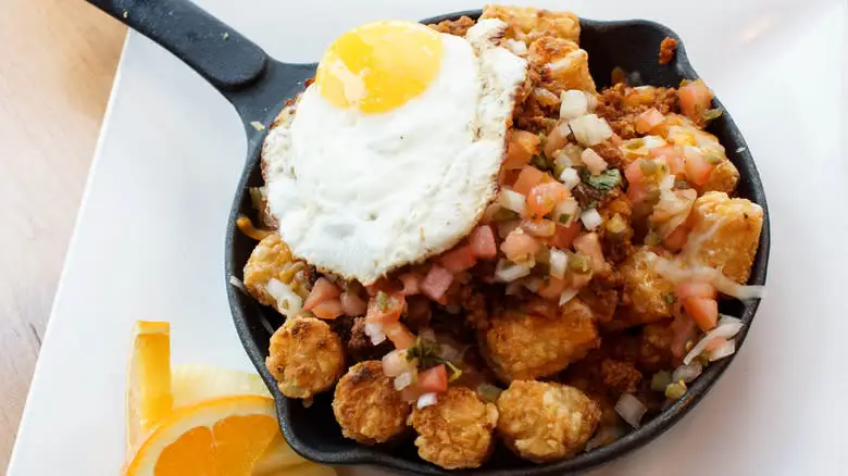 Close-up of tachos in a skillet with fried-egg