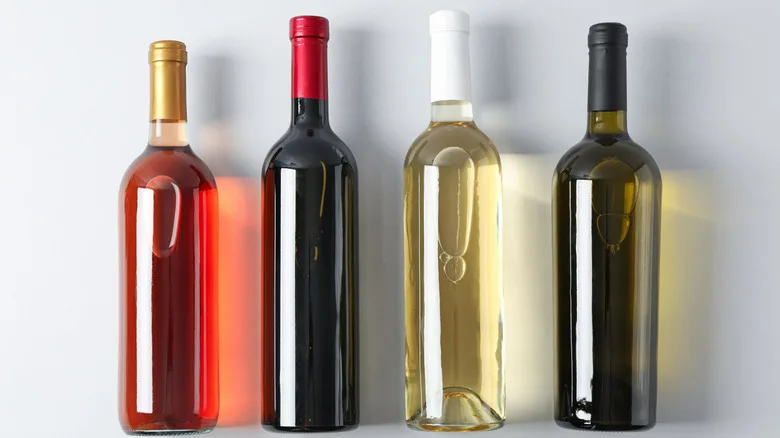 Four unlabeled bottles of wine