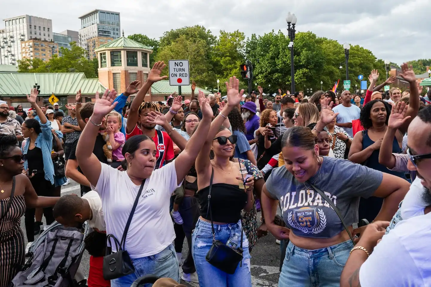 People waving during Denis Graca’s performance at PVDFest in downtown Providence, R.I., on Sept. 7, 2024.