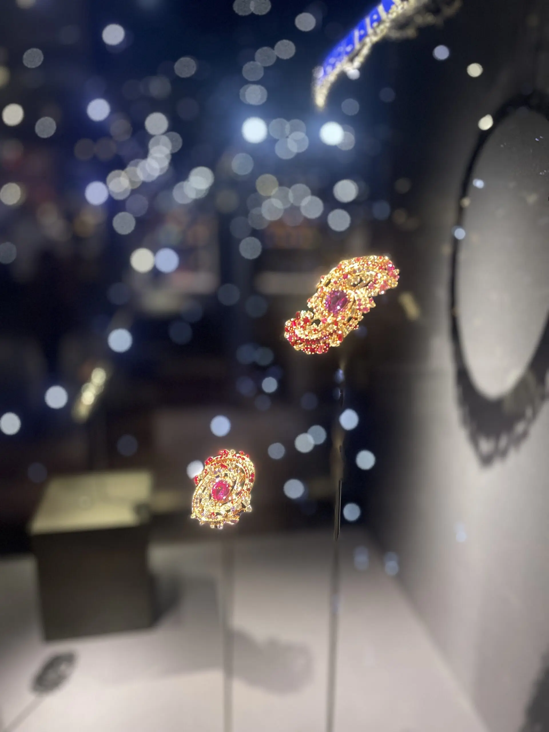 Two pendants with pink stones.