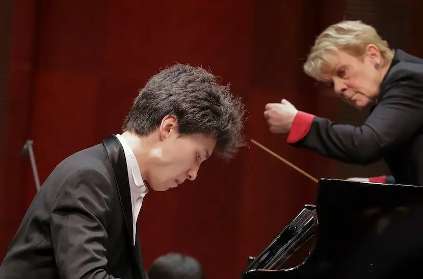 Pianist Angel Stanislav Wang and guest conductor Marin Alsop in performance with the Fort...