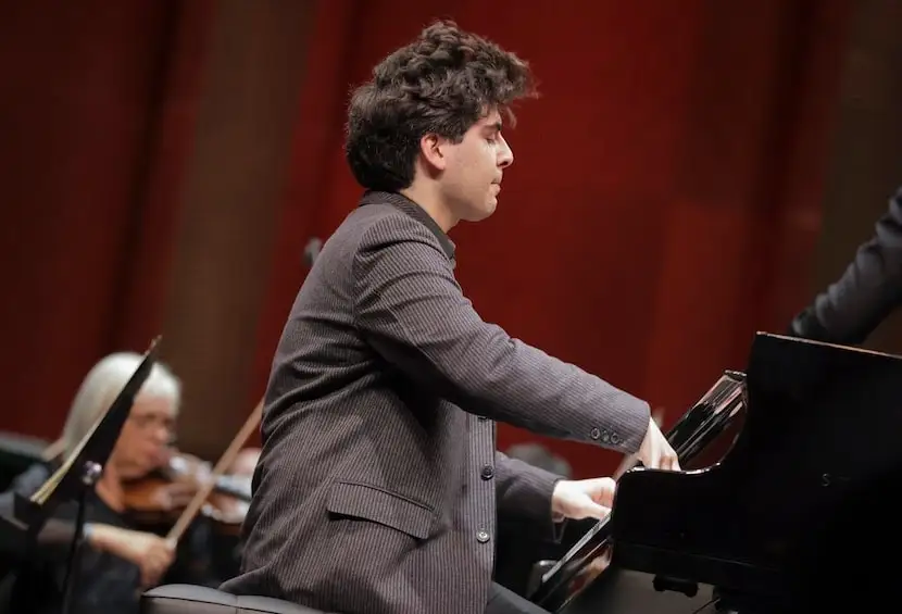 Pianist Evren Ozel in performance with the Fort Worth Symphony Orchestra and guest conductor...