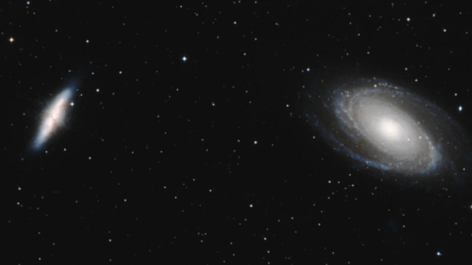 Two bright greatly seperated white swirls against a black background