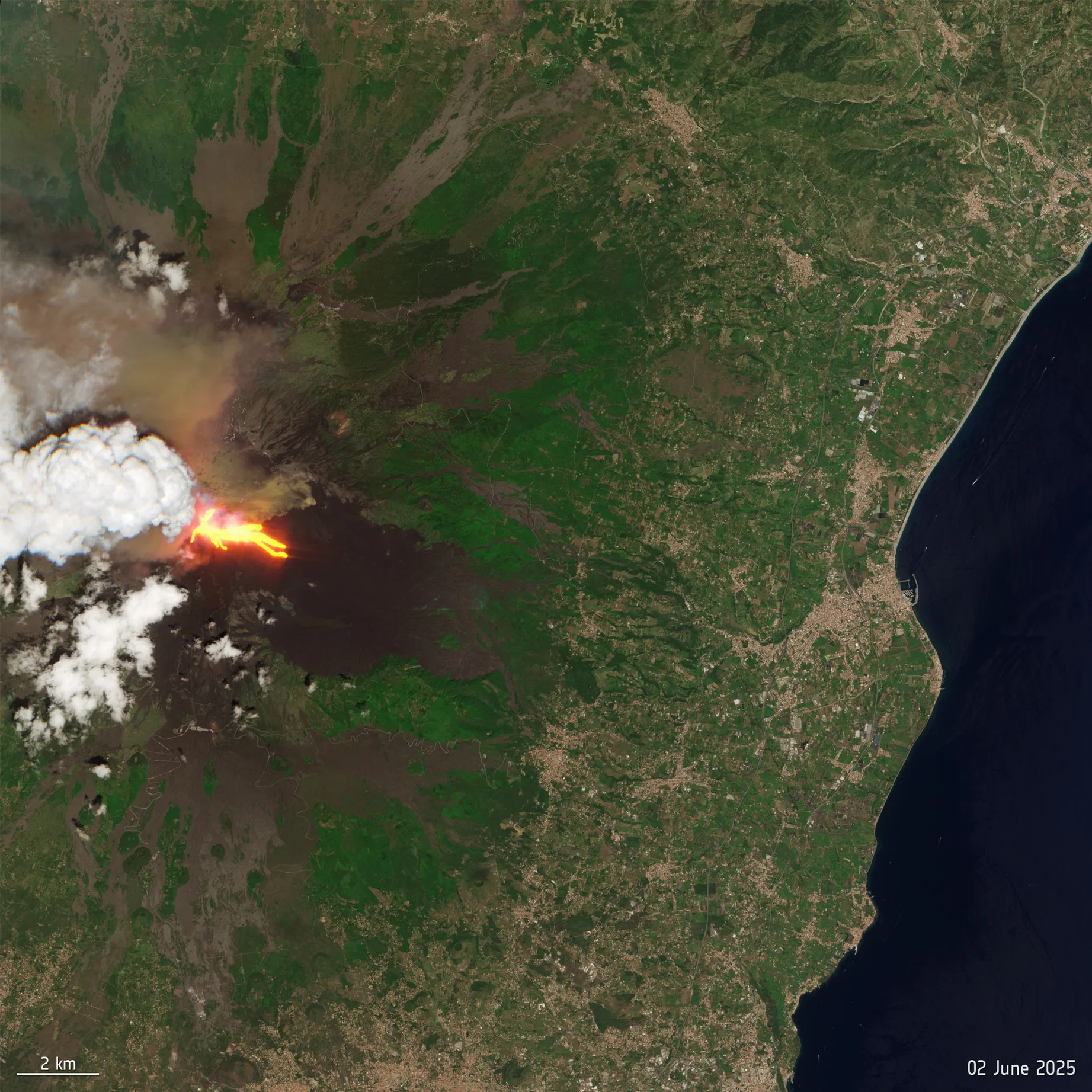 A large green shape with streaks of red and white clouds above it showing a volcano eruption of Mt. Etna