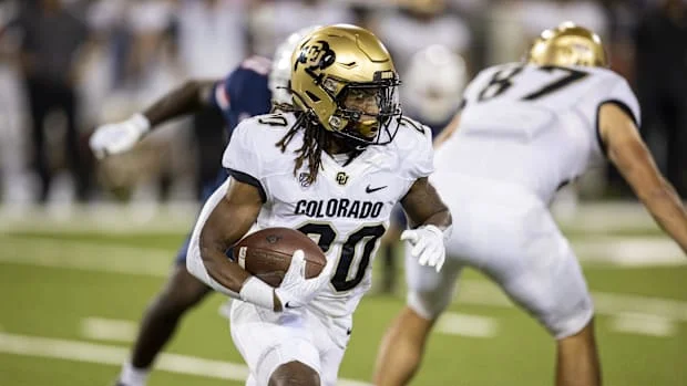 Colorado Buffaloes tailback Deion Smith (20) runs against the Arizona Wildcats in the first half at Arizona Stadium Colorado Buffaloes tailback Deion Smith (20) runs against the Arizona Wildcats in the first half at Arizona Stadium