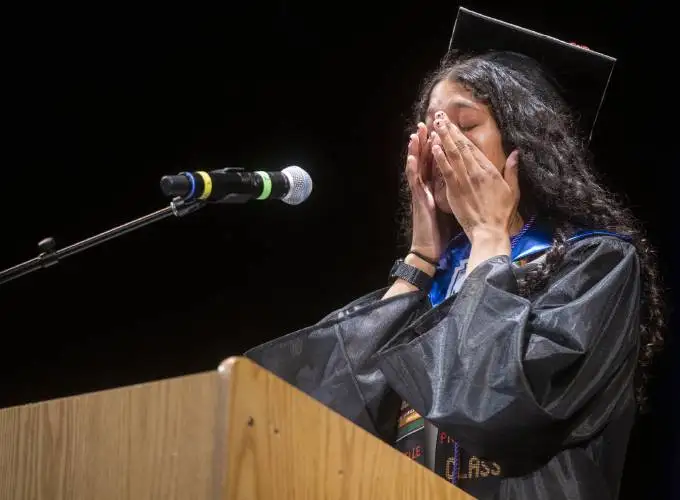 Graduate Danyelle Joujoute wipes away tears while speaking during the Pioneer Valley Performing Arts graduation ceremony at the Academy of Music, Thursday, June 5, 2025, in Northampton.
