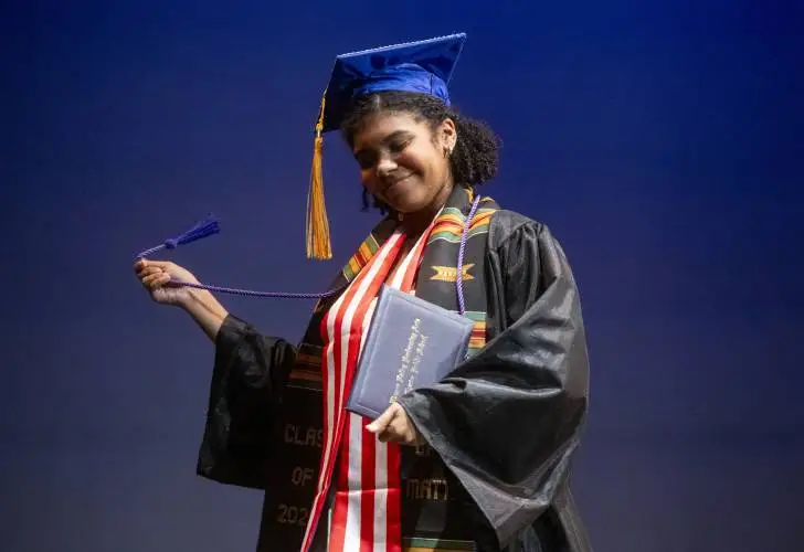 Graduate Alicia Ricks waves a cord around after receiving their diploma during the Pioneer Valley Performing Arts Charter School graduation ceremony at the Academy of Music, Thursday in Northampton.