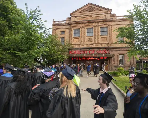 Graduates line up outside before the Pioneer Valley Performing Arts graduation ceremony at the Academy of Music, Thursday, June 5, 2025, in Northampton.