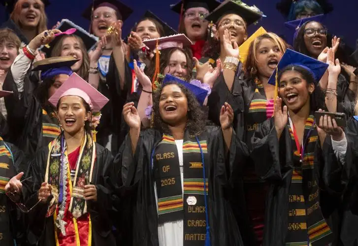 Graduates sing their class song during the Pioneer Valley Performing Arts Charter School graduation ceremony at the Academy of Music, Thursday in Northampton.