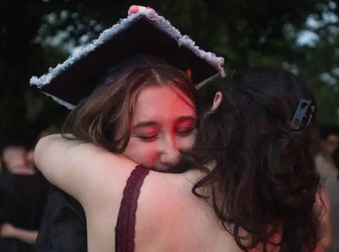 Graduate Milo Forrest, left, hugs Ayda Albrecht after the Pioneer Valley Performing Arts graduation ceremony at the Academy of Music, Thursday, June 5, 2025, in Northampton.