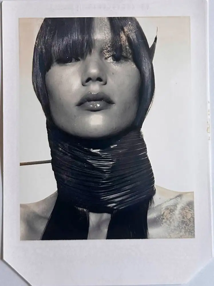 Photo of a girl with a leaf around her face and neck by Donna Trope