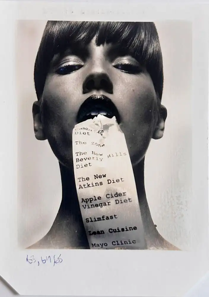 Photo of a model with paper in her mouth by Donna Trope