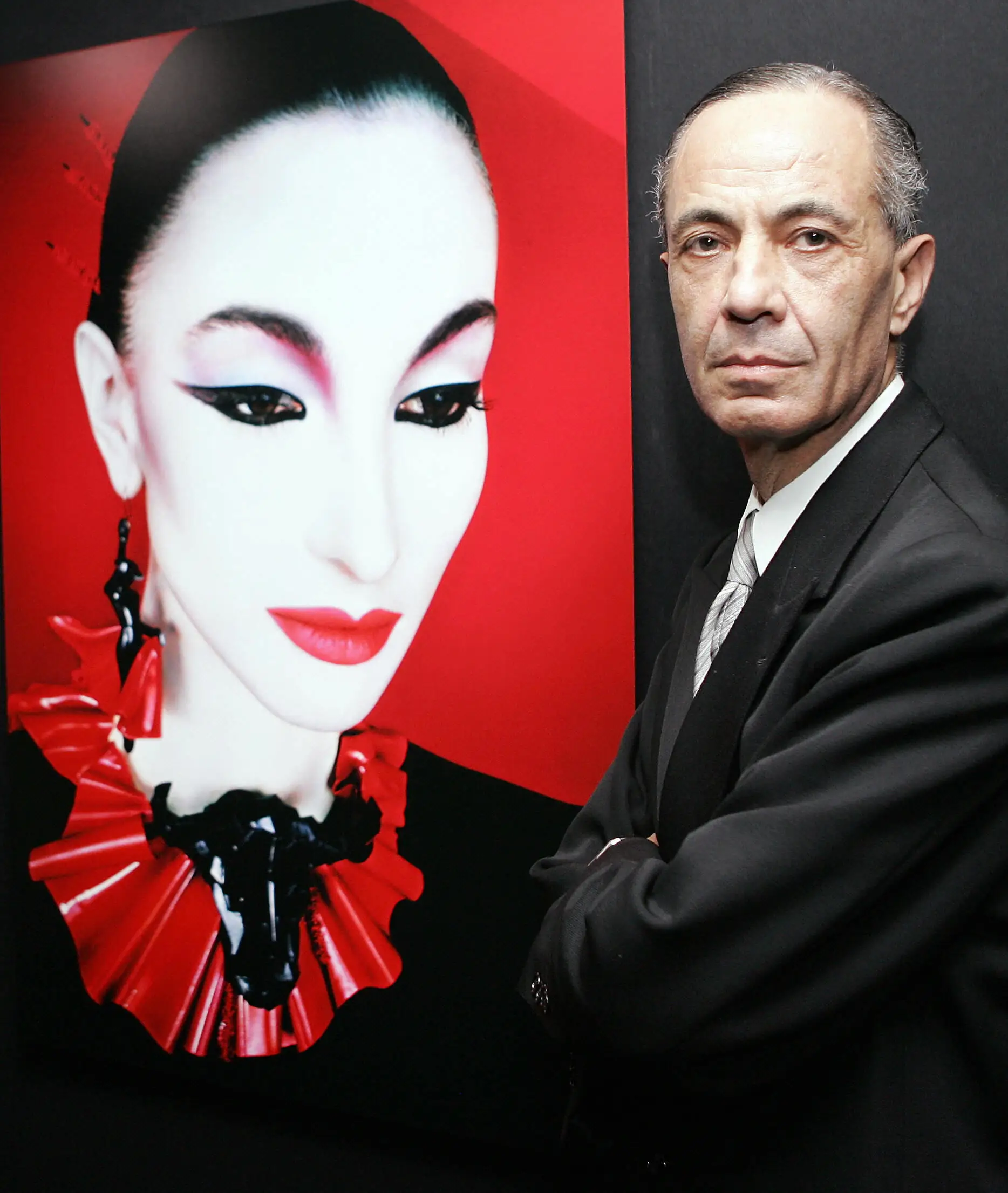 Serge Lutens, beside a Shiseido beauty poster