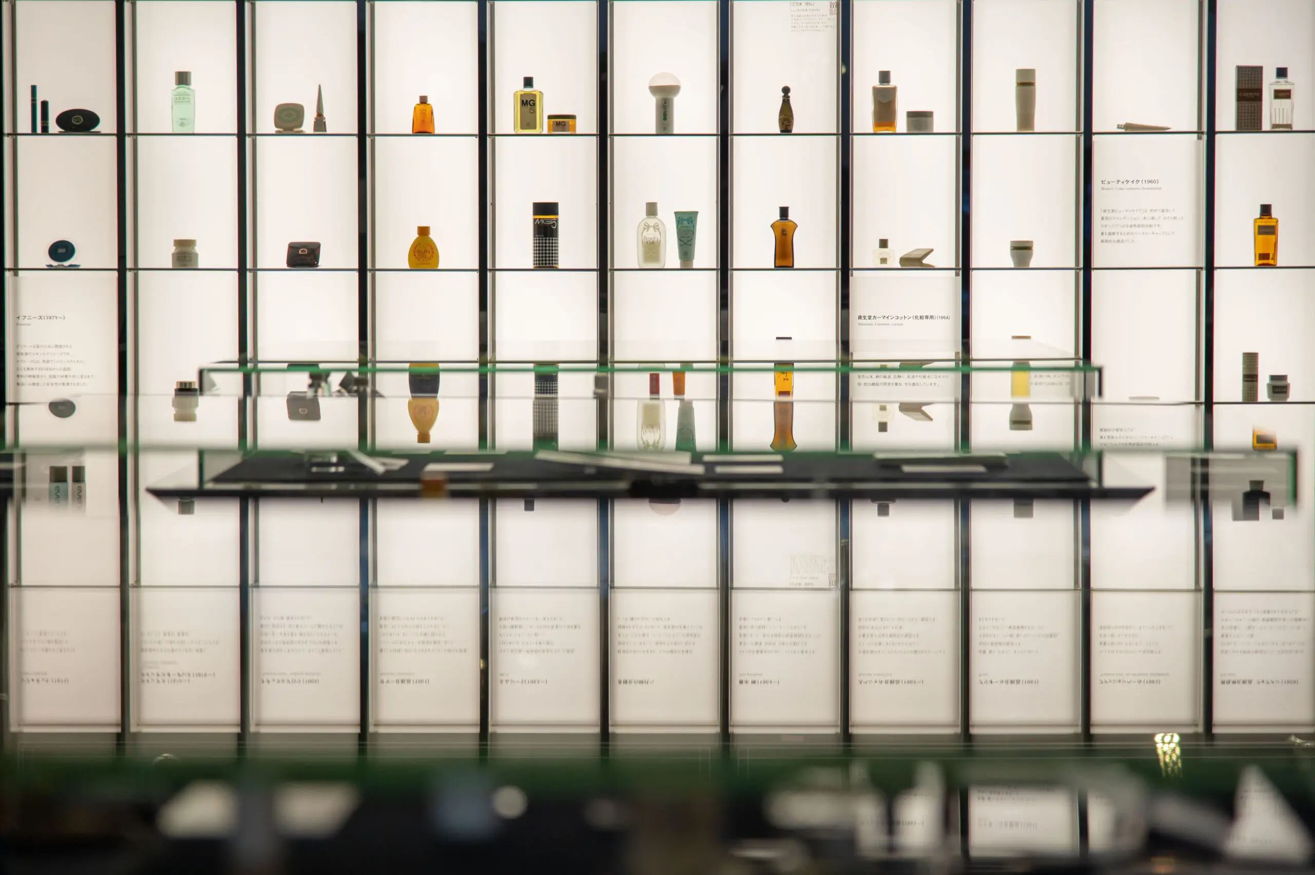 Products on backlit shelves at Shiseido Corporate Museum