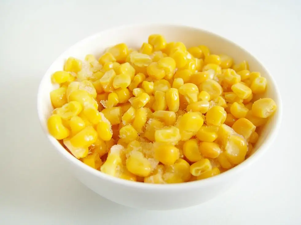 healthy frozen foods: a white bowl of frozen sweetcorn