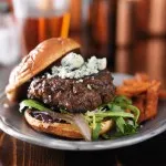 burger with blue cheese served with beer