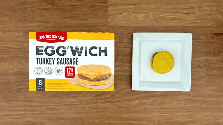 Red's turkey sausage eggwich on plate with packaging