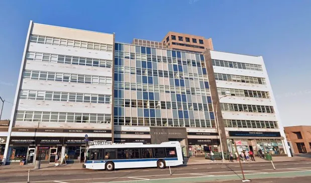 The Queens Boulevard building housing the offices of Queens Defenders. (Google)