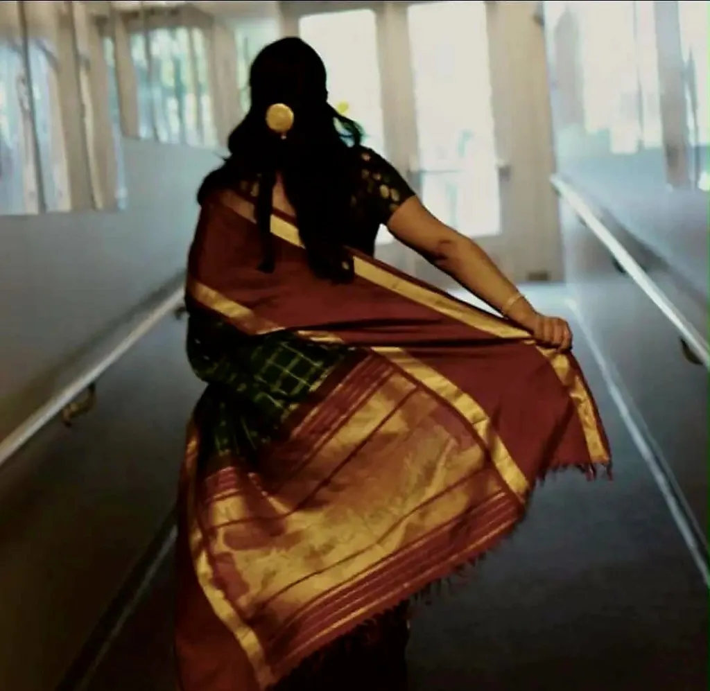 Anita Manon in the studio, amid a swirl of costume. Photo via Anjali School of Dance Facebook page.