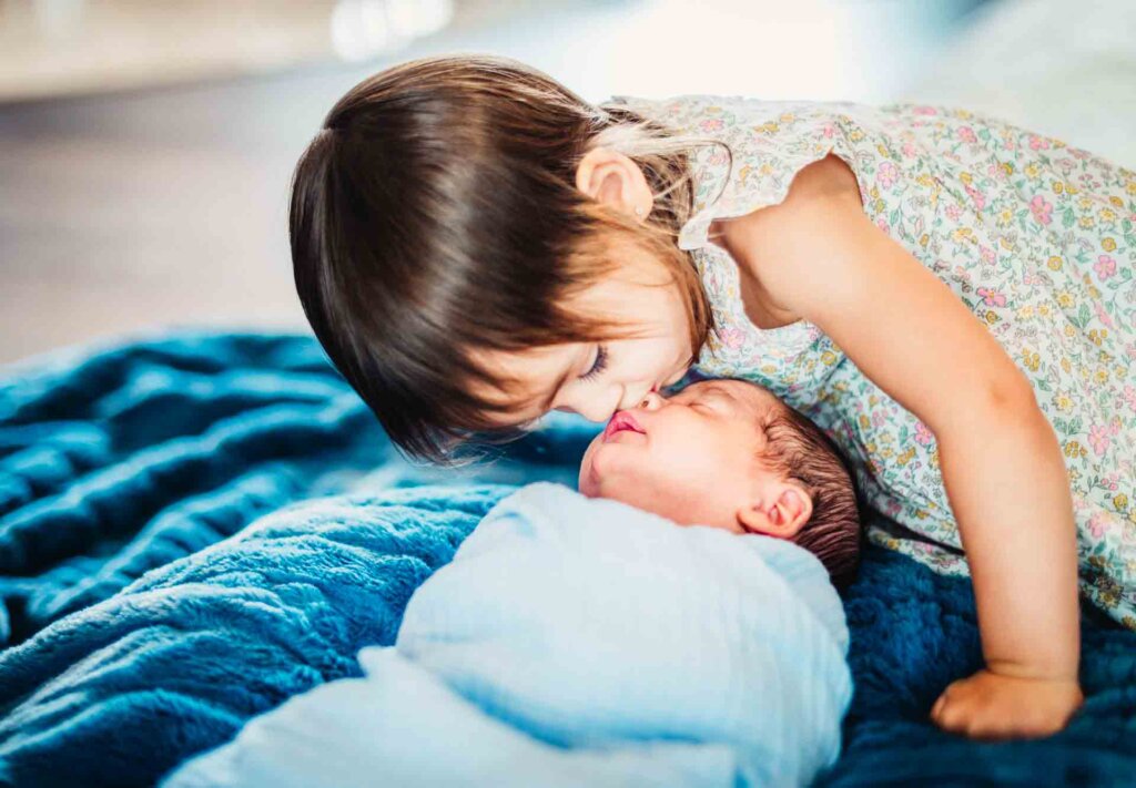 How Can I Get My Older Child to Bond with Her Baby Sibling?