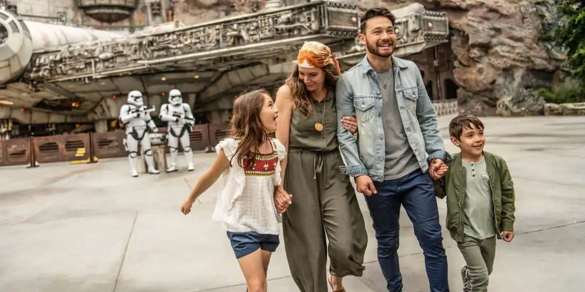 A family walks through Galaxy's Edge at Disneyland