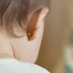 Infant with ear pierced