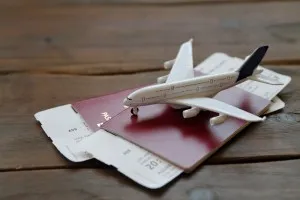 Toy Airplane With Passports and Flight booking ticket. Travel concept.