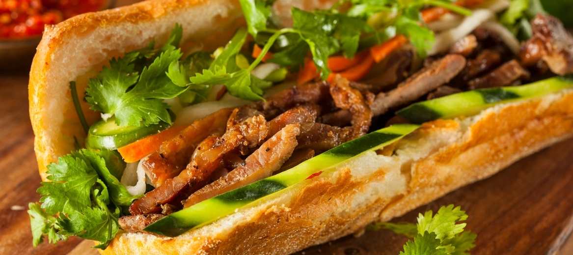 Baguette with meat is called banh mi in Vietnamese cuisine. The perfect homemade banh mi sandwich is as simple as assembling a baguette, pork, and lemongrass.