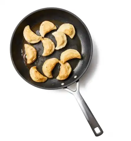 If frying the pierogi, put them in the hot pan and fry, shaking the pan to move them around, until lightly golden, then add the onions and browned butter just before serving.