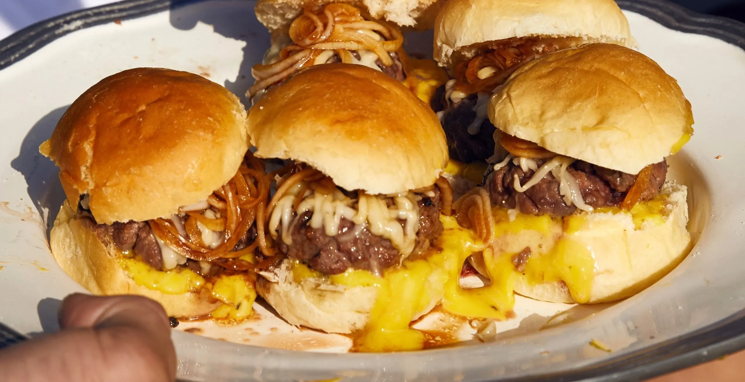 PHOTO: A plate of beef sliders with provolone and balsamic onions.