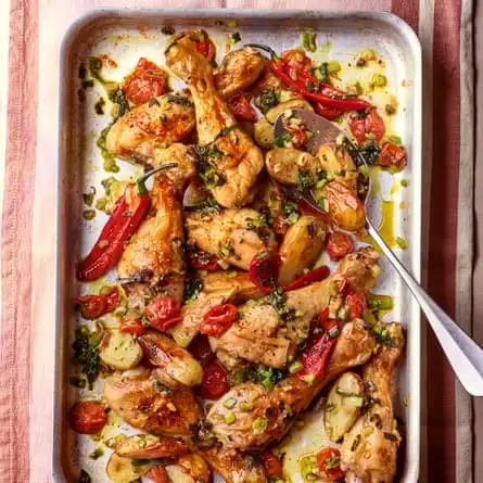 Chicken drumsticks roasted with cherry tomatoes, spring onions, sage and chilli