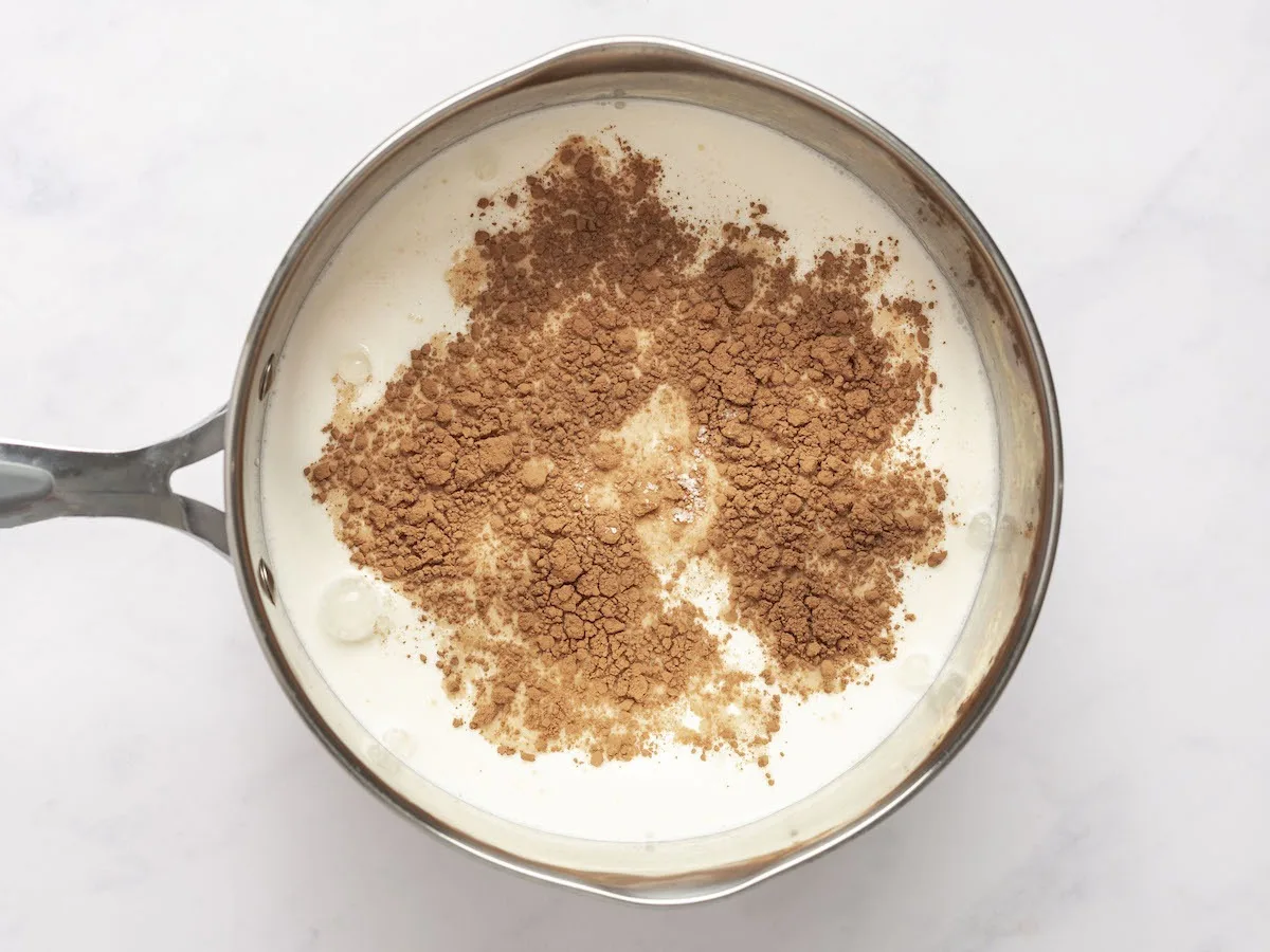 brown sugar, cocoa powder, and salt added to milk in cream in medium saucepan
