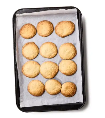Heat the oven to 200C (180C fan)/390F/gas 6, and line two baking trays with greaseproof paper. Tear off small pieces of the dough, roll these into balls, then arrange on the trays spaced well apart. Bake for 18-20 minutes, until golden brown, then remove and leave to cool completely.