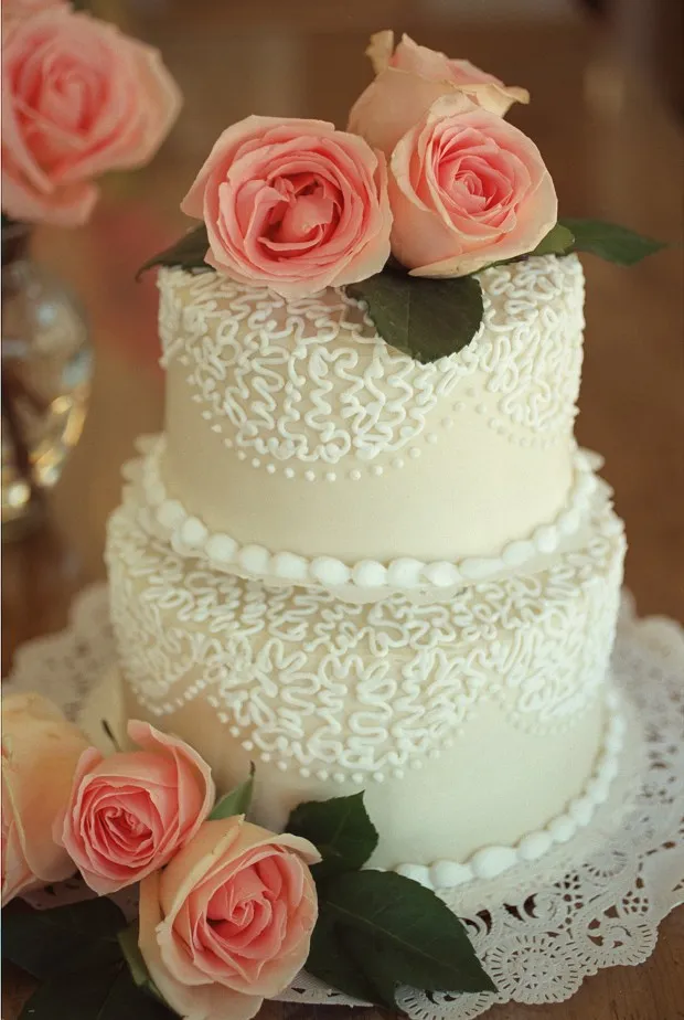 A dense moist chocolate buttermilk cake with raspberry filling and rich cream cheese icing in a lacework pattern is one of the wedding cakes offered at Los Gatos' Icing on the Cake bakery. (Patrick Tehan/Bay Area News Group File)
