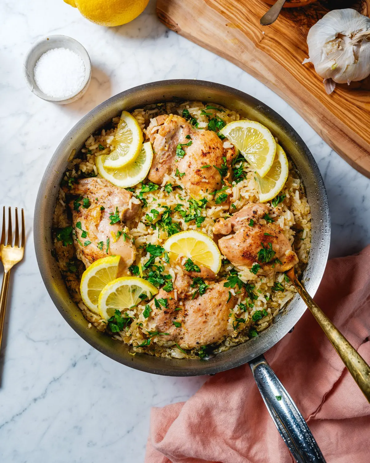 Chicken and Rice recipe in skillet with lemons