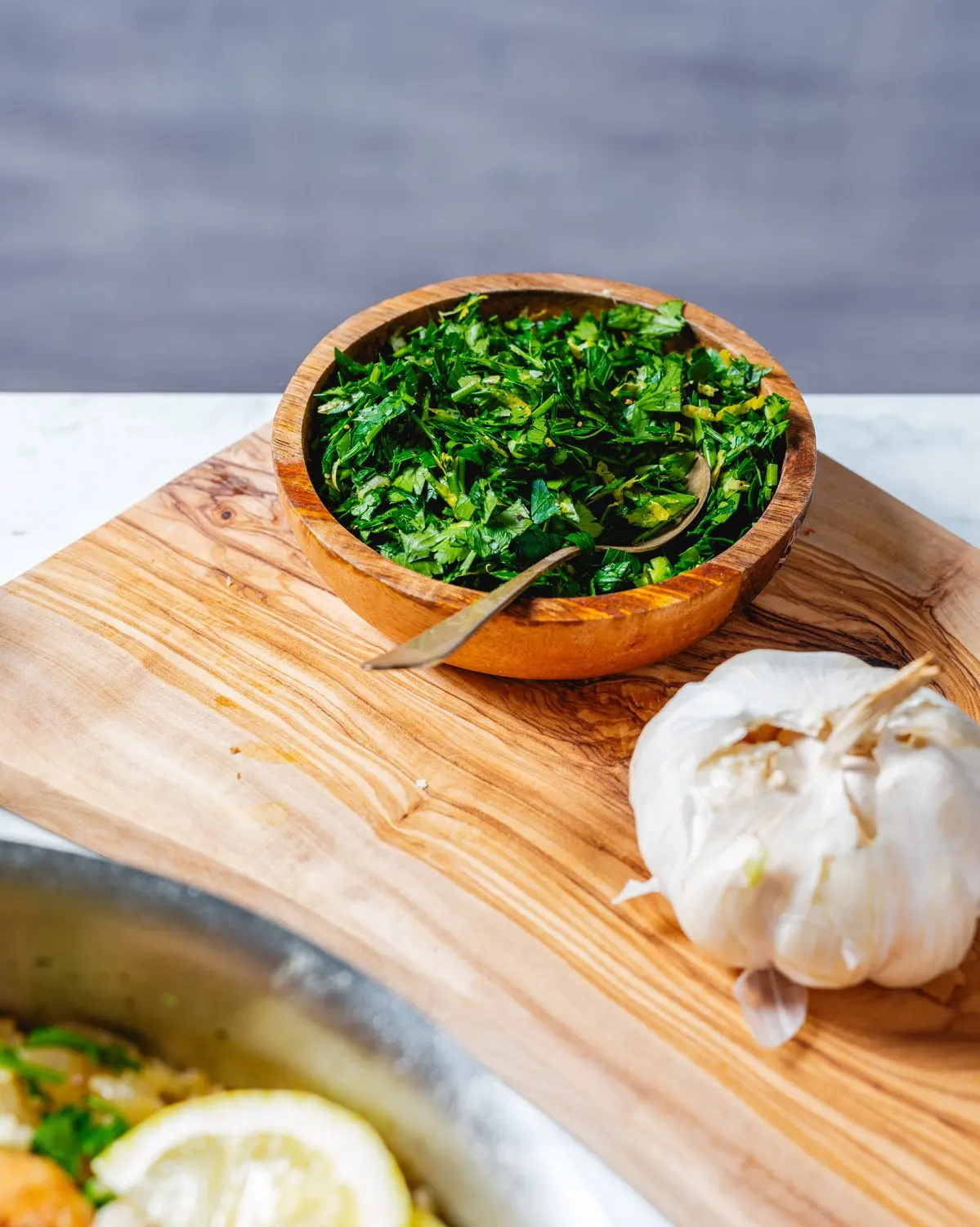 Gremolata dish next to garlic head