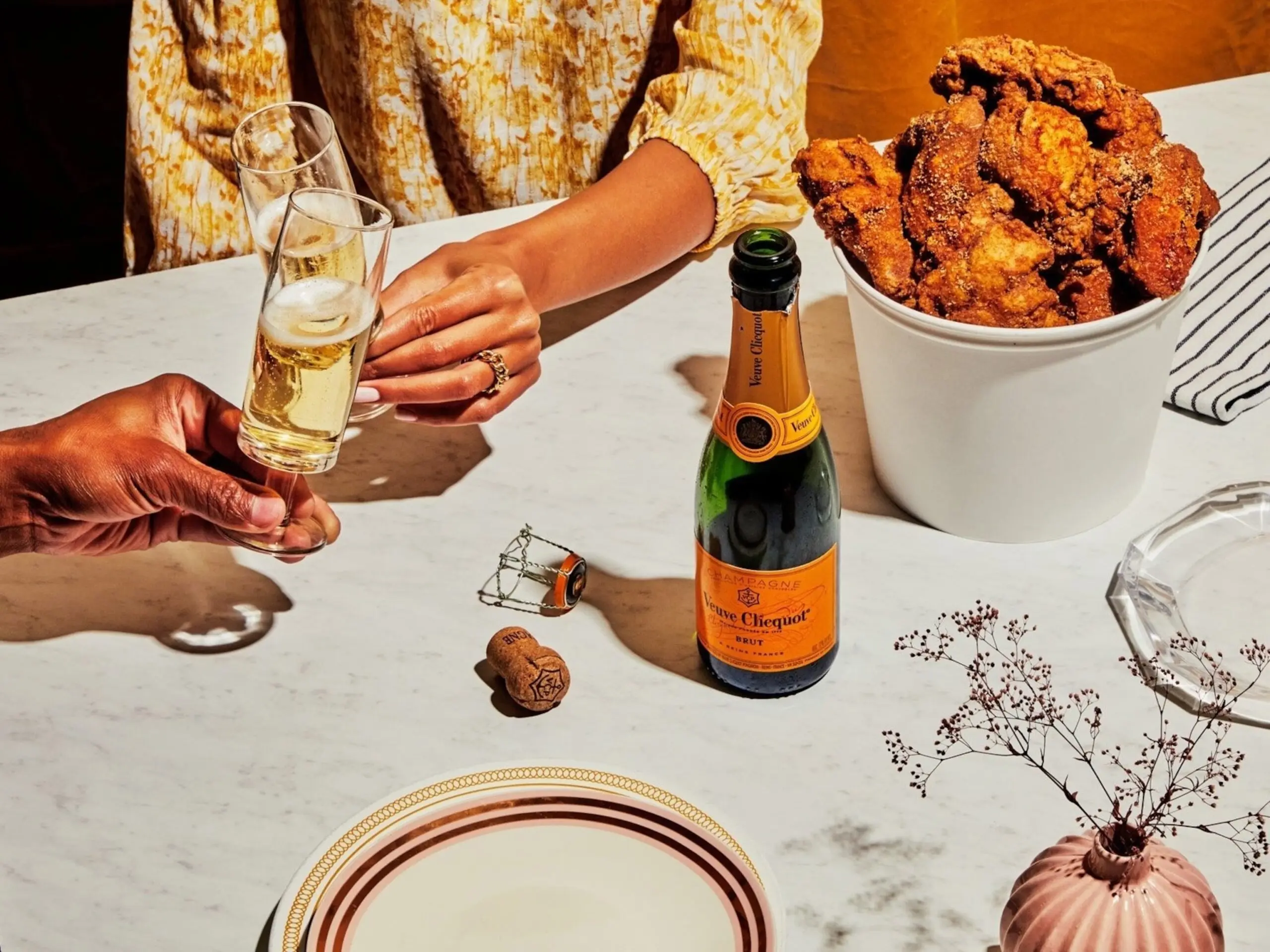 PHOTO: A food styled shoot with fried chicken paired with champagne.