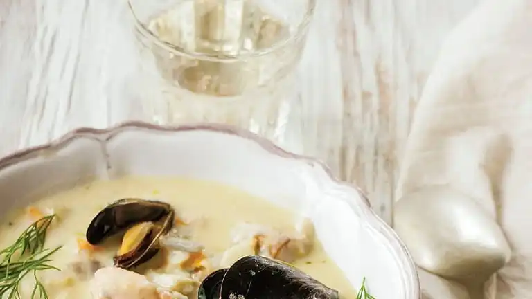 This image shows a recipe for creamy seafood chowder from...