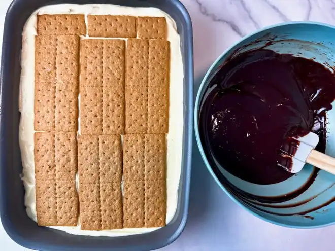 Easy, 3-ingredient chocolate ganache is the finishing touch for chocolate eclair cake.