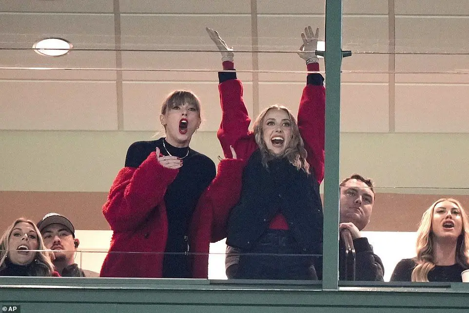 Swift opted to borrow a red Stella McCartney teddy coat from her pal, Brittany Mahomes, while braving the cold in Green Bay, Wisconsin at Lambeau Field (seen on December 3, 2023)