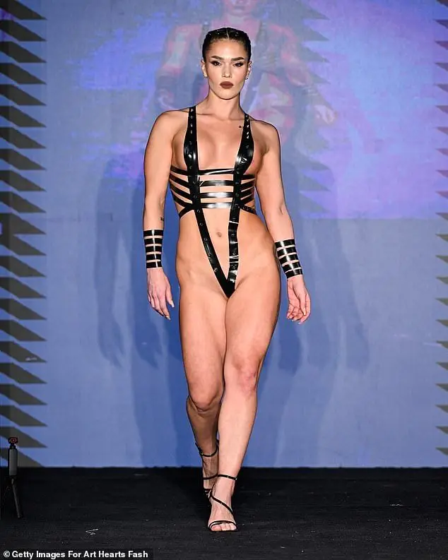 This bandage-inspired bodysuit featured narrow strips of black tape that were wound around the body
